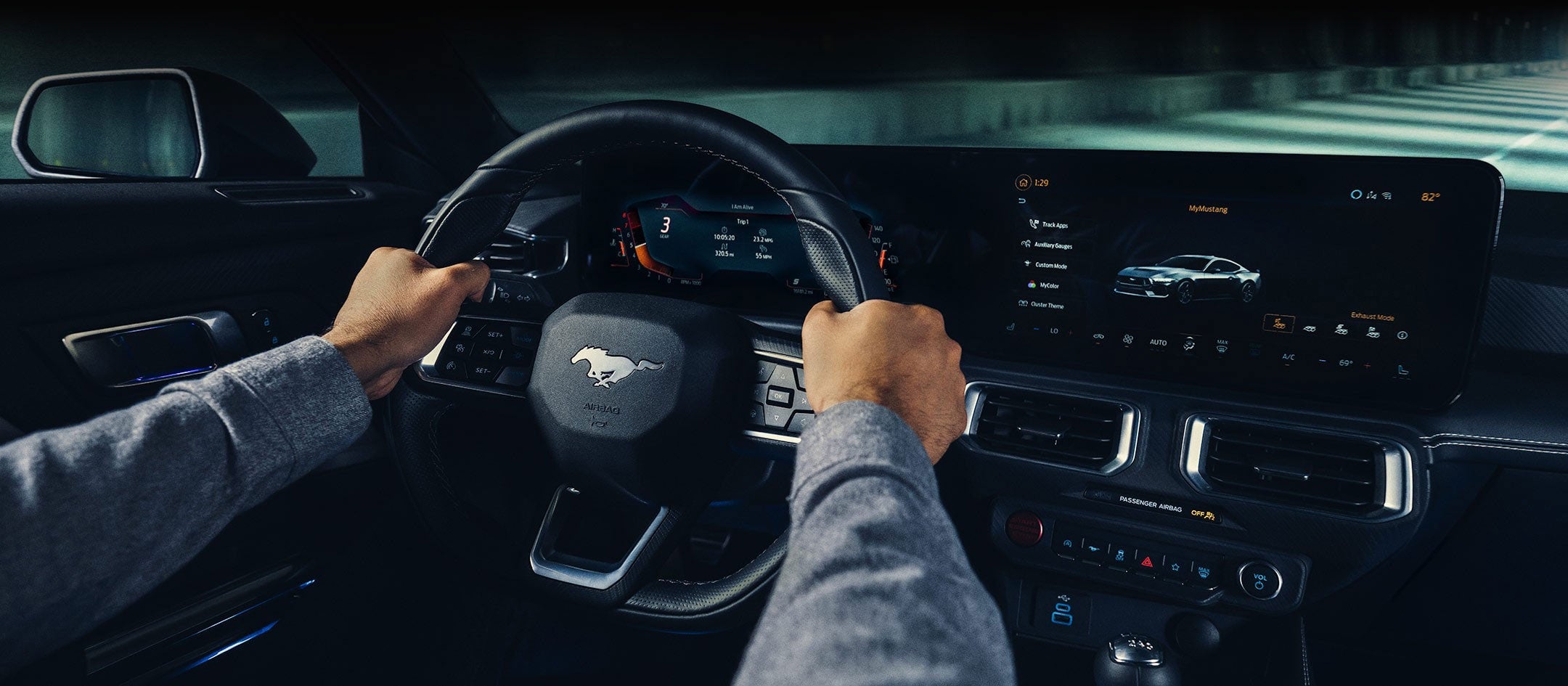 A 2024 Ford Mustang® model interior with a person driving | Midland Ford in Midland MI